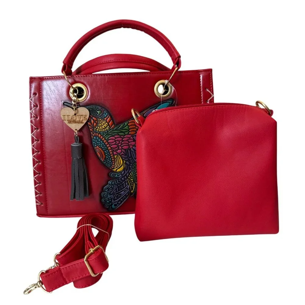 Tooled multicolored hummingbird on a vegan leather red satchel with make up bag